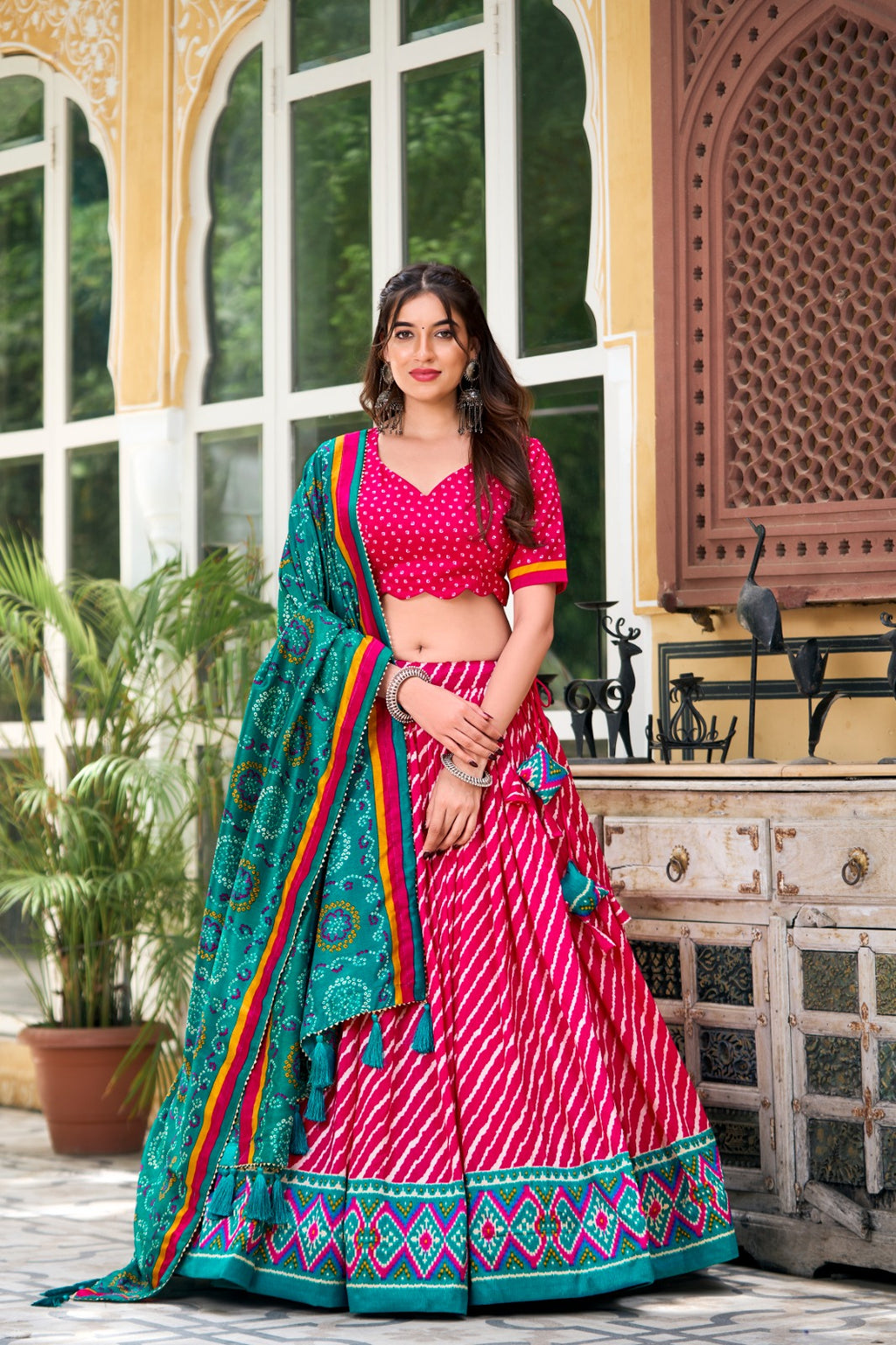 Lehenga Choli -  Embrace Cultural Grandeur with Our Elegant Leheriya Print Tussar Silk Lehenga Choli, Featuring a Gorgeous Patola Print Border and an Exquisite Bandhani Print Dupatta Color - Pink