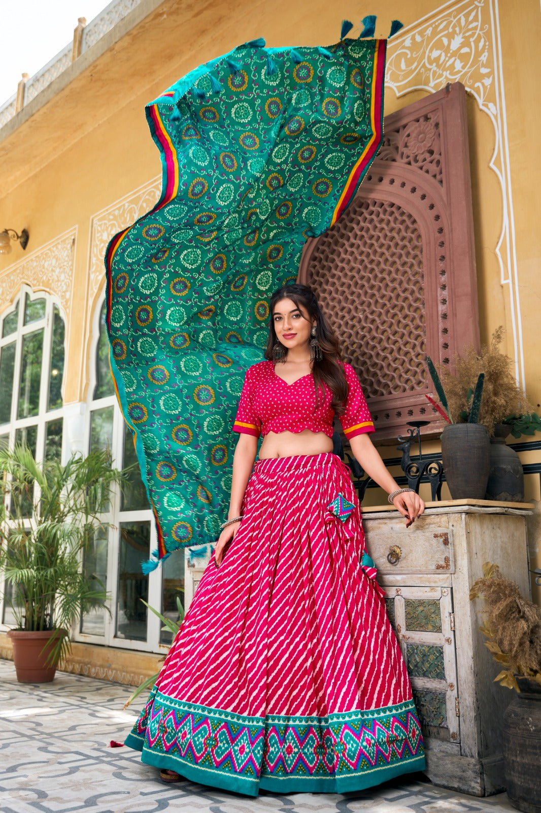 Lehenga Choli -  Embrace Cultural Grandeur with Our Elegant Leheriya Print Tussar Silk Lehenga Choli, Featuring a Gorgeous Patola Print Border and an Exquisite Bandhani Print Dupatta Color - Pink