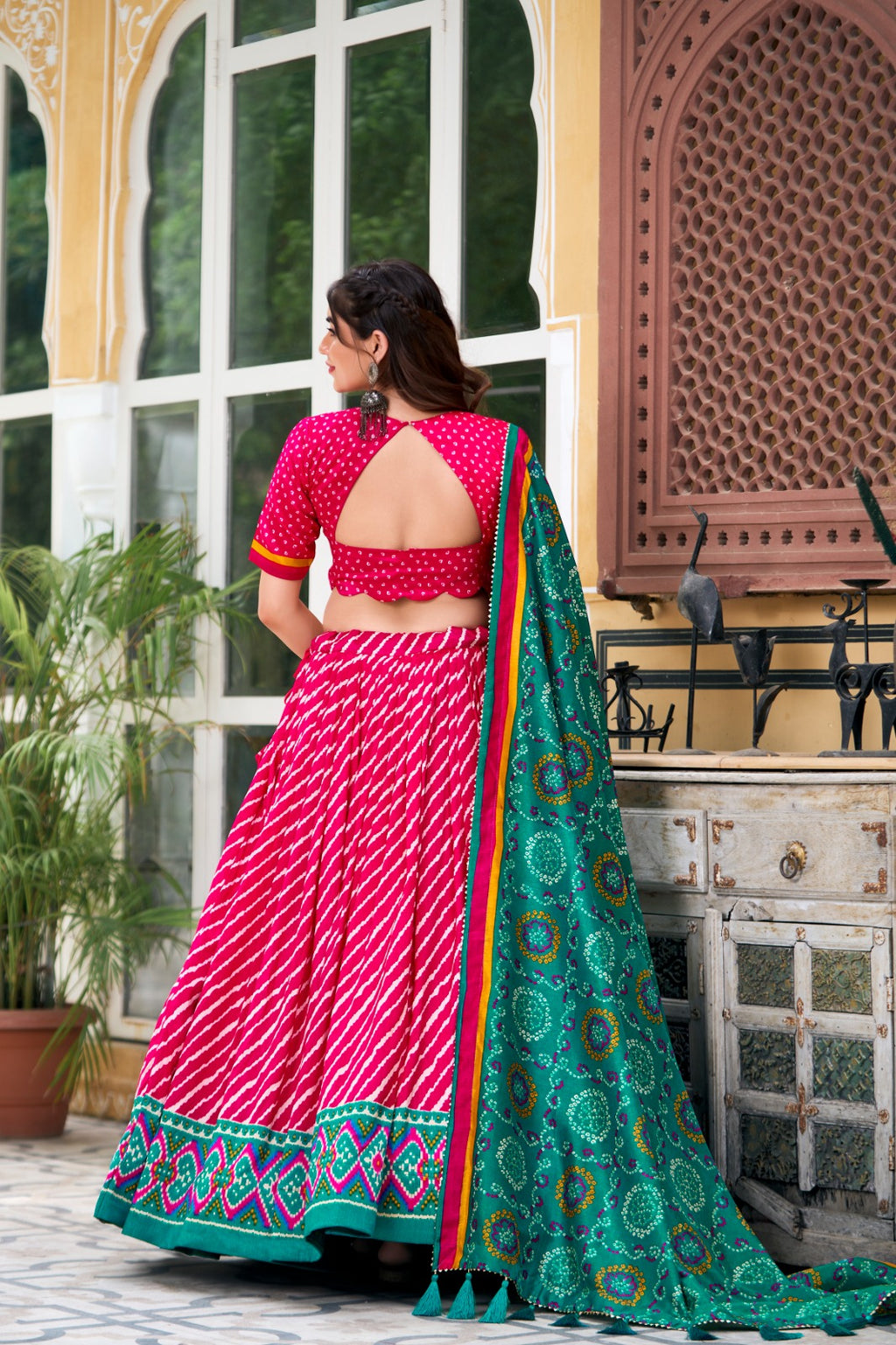 Lehenga Choli -  Embrace Cultural Grandeur with Our Elegant Leheriya Print Tussar Silk Lehenga Choli, Featuring a Gorgeous Patola Print Border and an Exquisite Bandhani Print Dupatta Color - Pink
