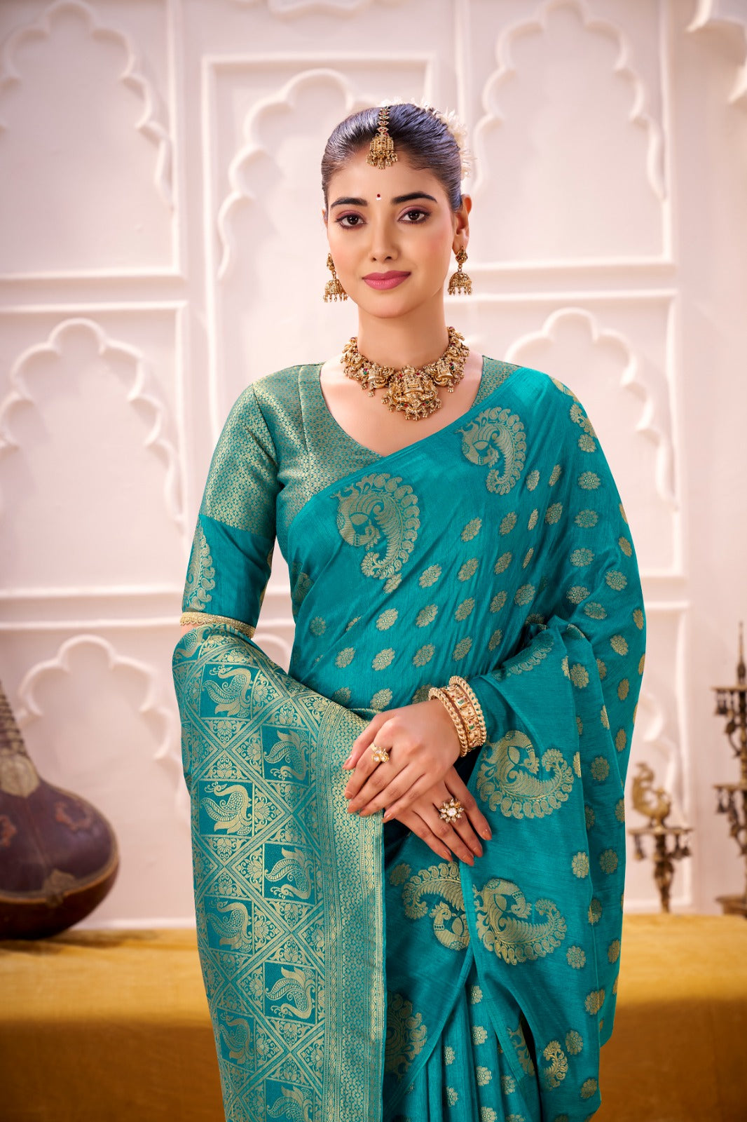 Draped in the Opulence of Roop Silk woven with zari work (Firozi)