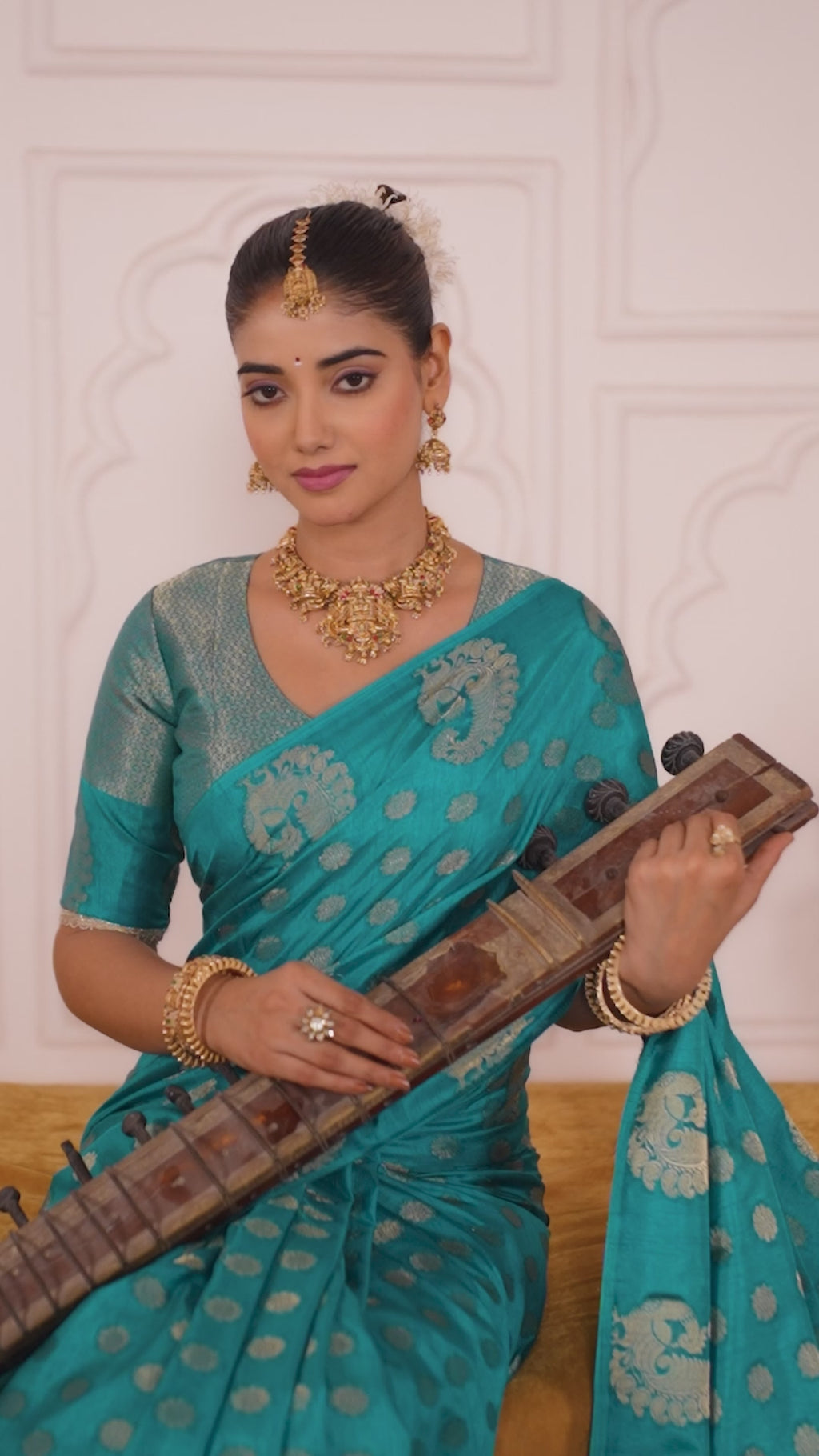 Draped in the Opulence of Roop Silk woven with zari work (Firozi)